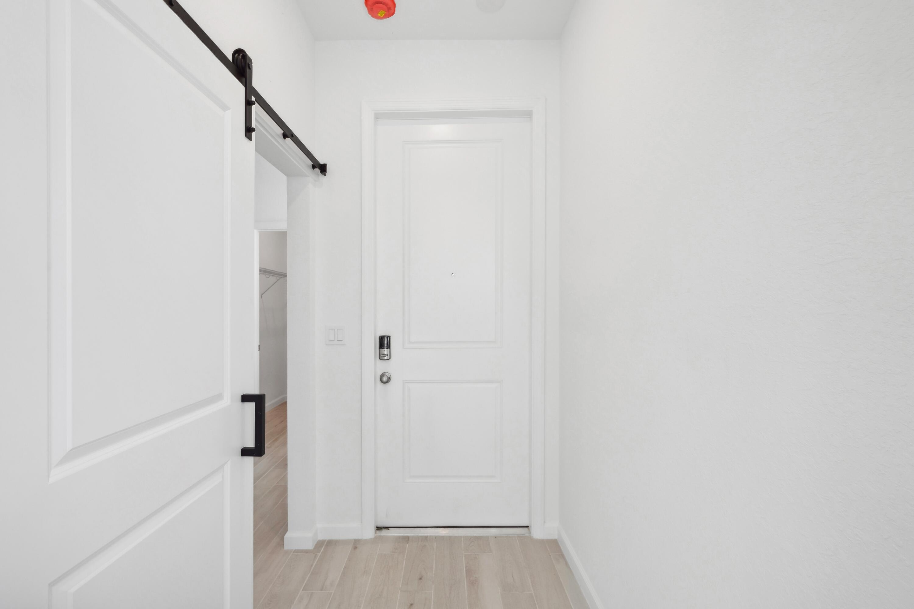 10099 Dreamweaver Road, Unit 51 Port St. Lucie, FL 34987 - Photo 2 of 36 a view of a hallway