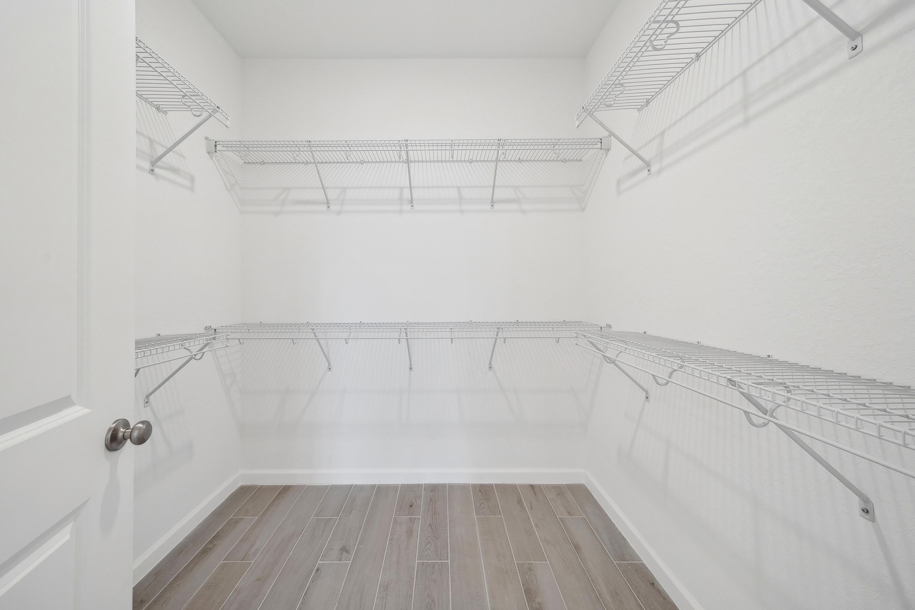 10099 Dreamweaver Road, Unit 51 Port St. Lucie, FL 34987 - Photo 23 of 36 a view of a room with racks on the wall