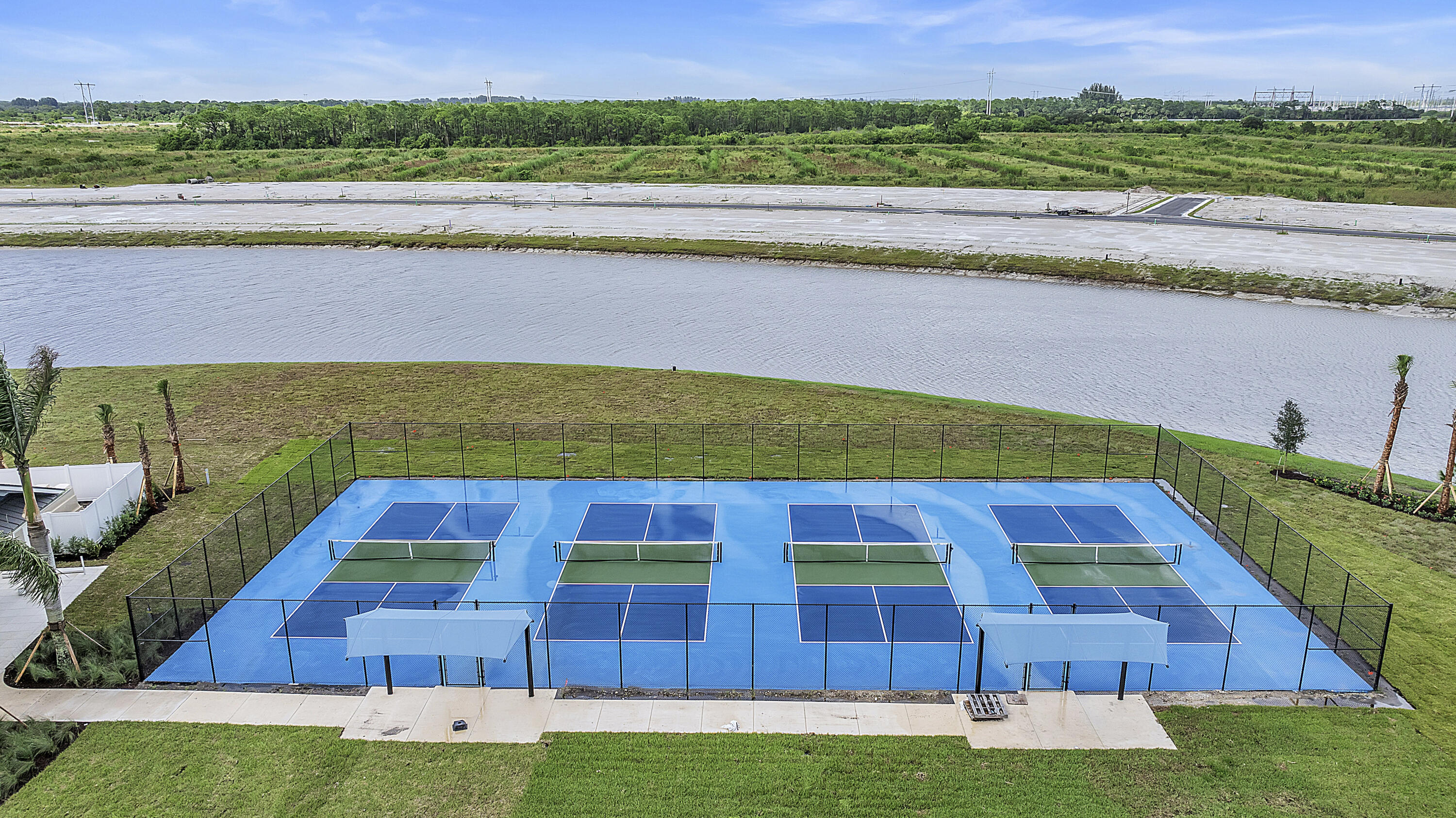 10099 Dreamweaver Road, Unit 51 Port St. Lucie, FL 34987 - Photo 26 of 36 a view of an outdoor space and swimming pool