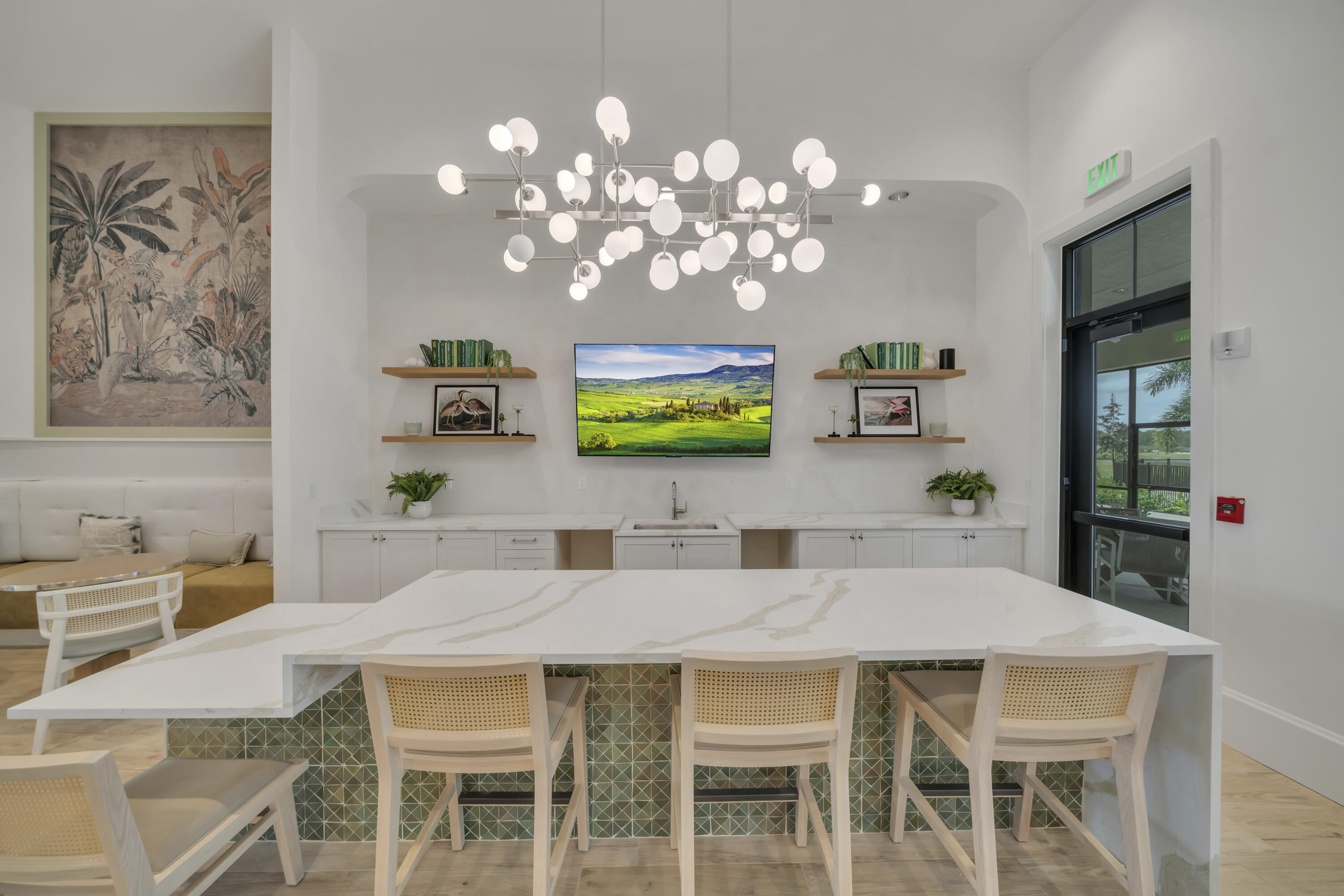 10099 Dreamweaver Road, Unit 51 Port St. Lucie, FL 34987 - Photo 31 of 36 a view of a dining room with furniture and chandelier