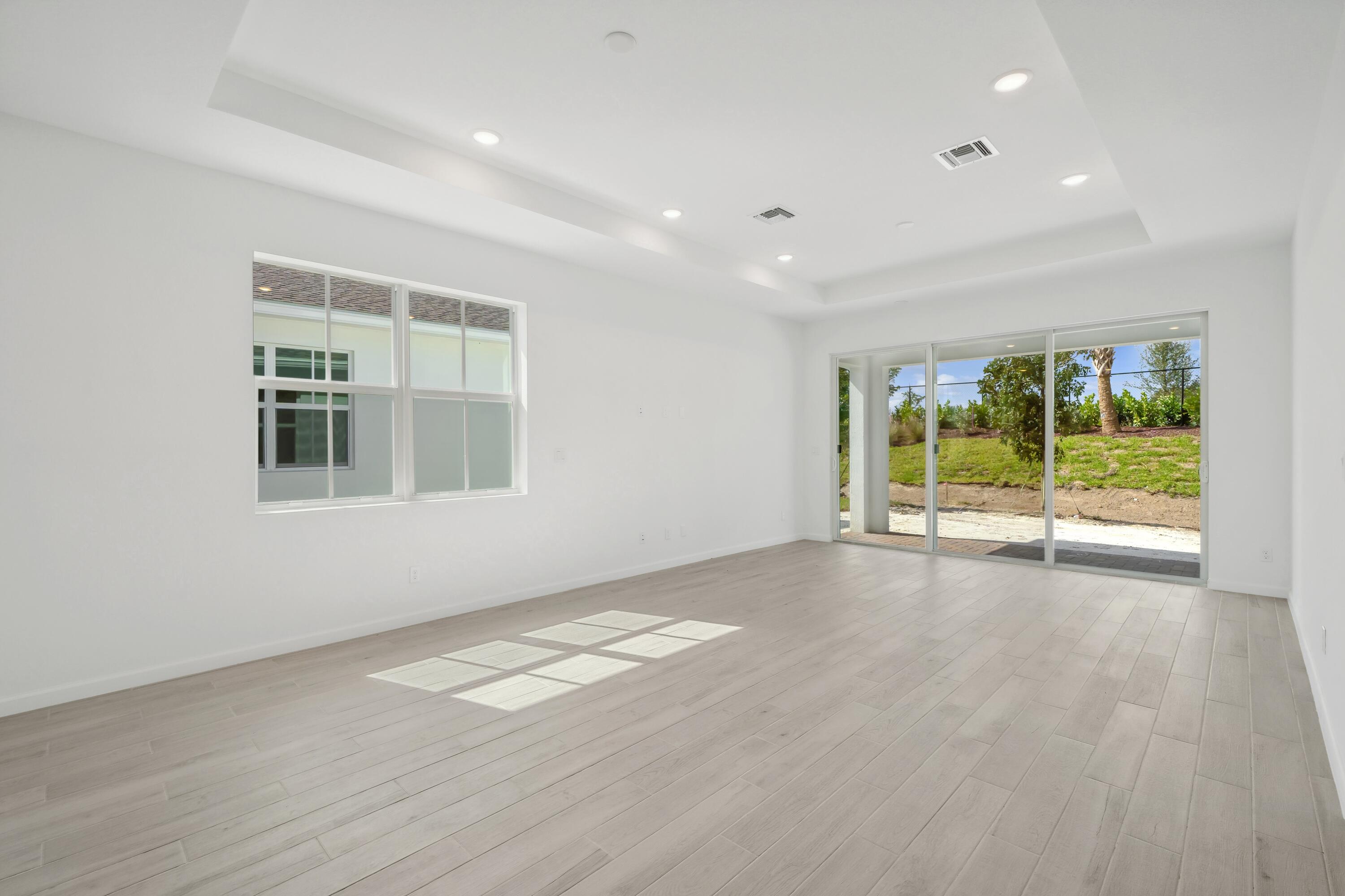 10099 Dreamweaver Road, Unit 51 Port St. Lucie, FL 34987 - Photo 10 of 36 a view of an empty room with a window