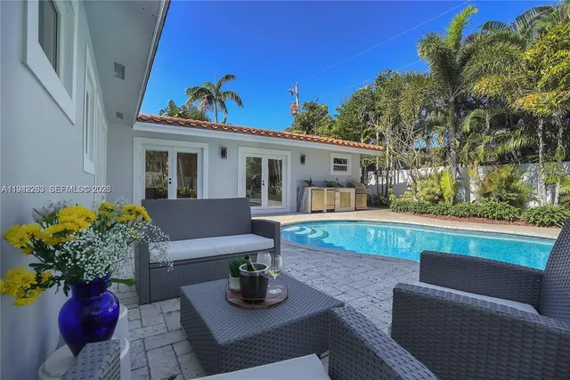 a view of house with outdoor seating