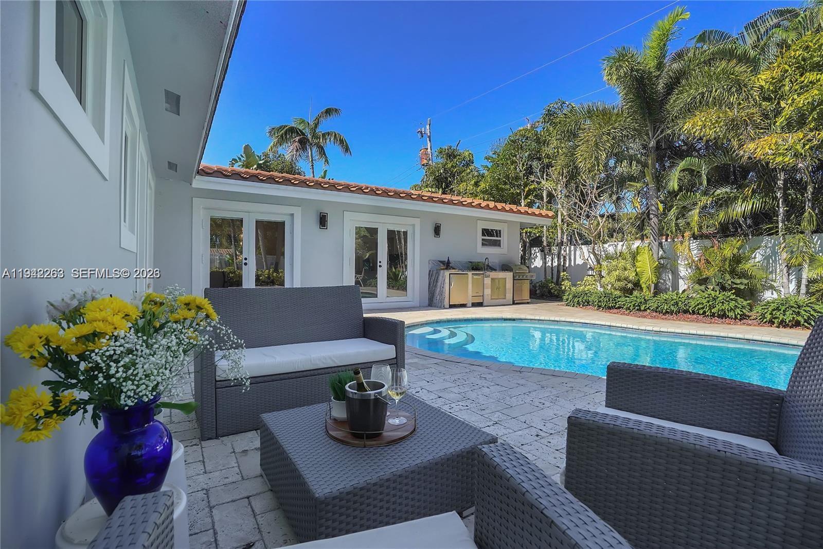 2011 Northeast 31st Court Lighthouse Point, FL 33064 - Photo 12 of 33 a view of house with outdoor seating
