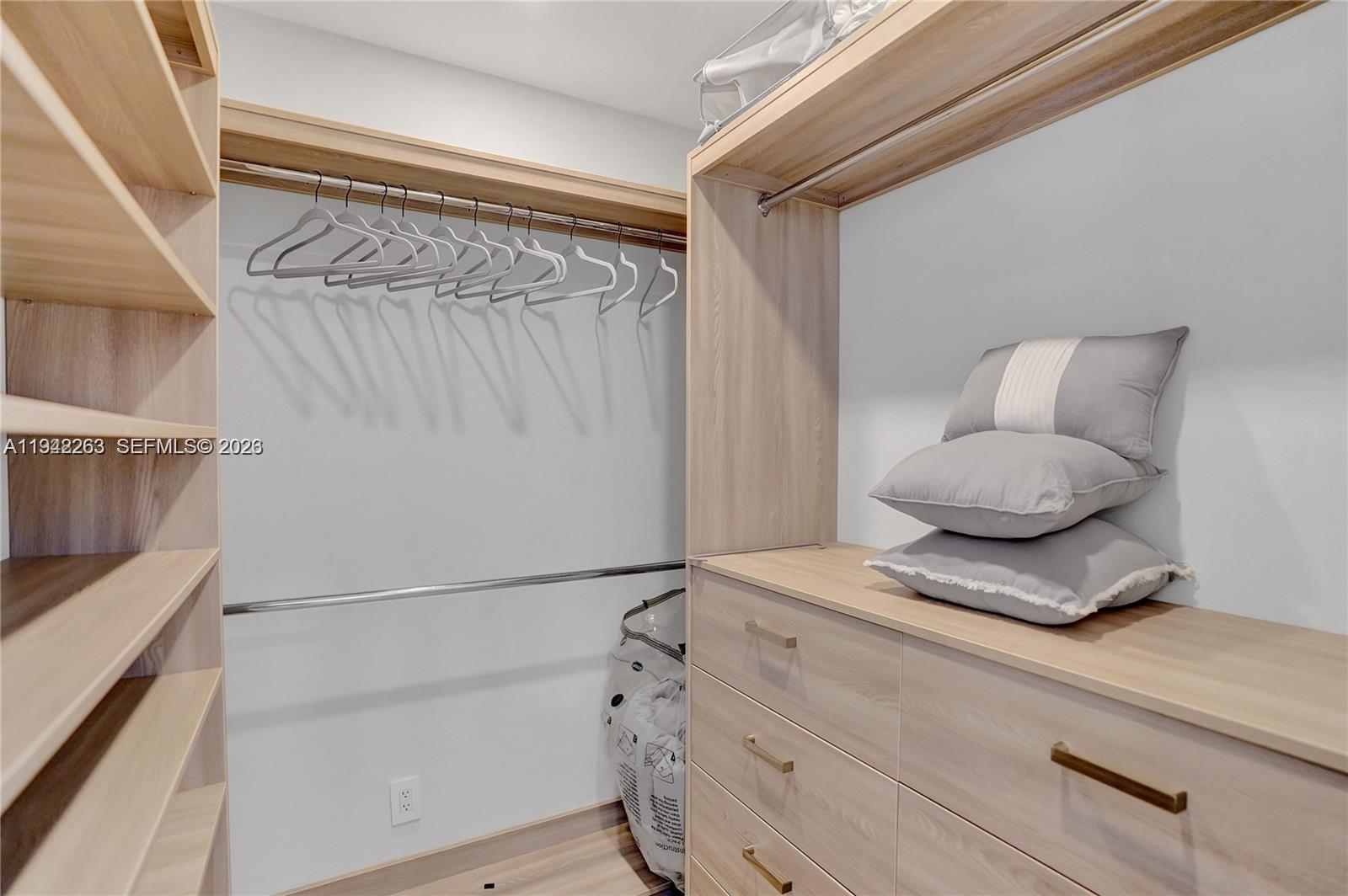 2011 Northeast 31st Court Lighthouse Point, FL 33064 - Photo 19 of 33 a bedroom with a bed and a potted plant on the dresser