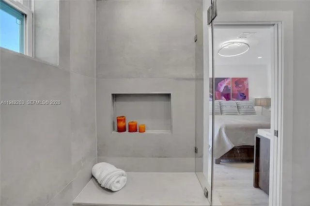 a bathroom with a bathtub and a shower