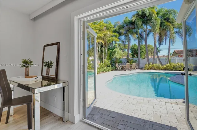 a dining table with a potted plant and a table view