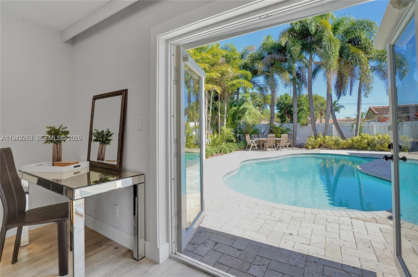 2011 Northeast 31st Court Lighthouse Point, FL 33064 - Photo 23 of 33 a dining table with a potted plant and a table view