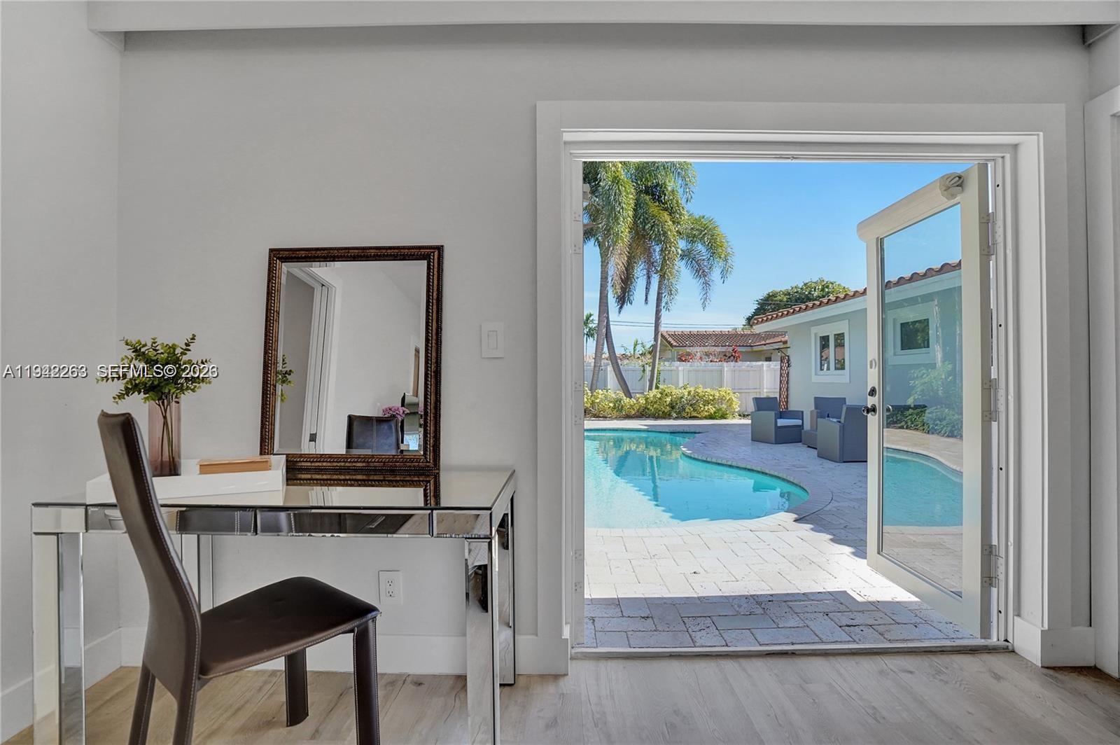 2011 Northeast 31st Court Lighthouse Point, FL 33064 - Photo 24 of 33 a view of kitchen with furniture and a potted plant
