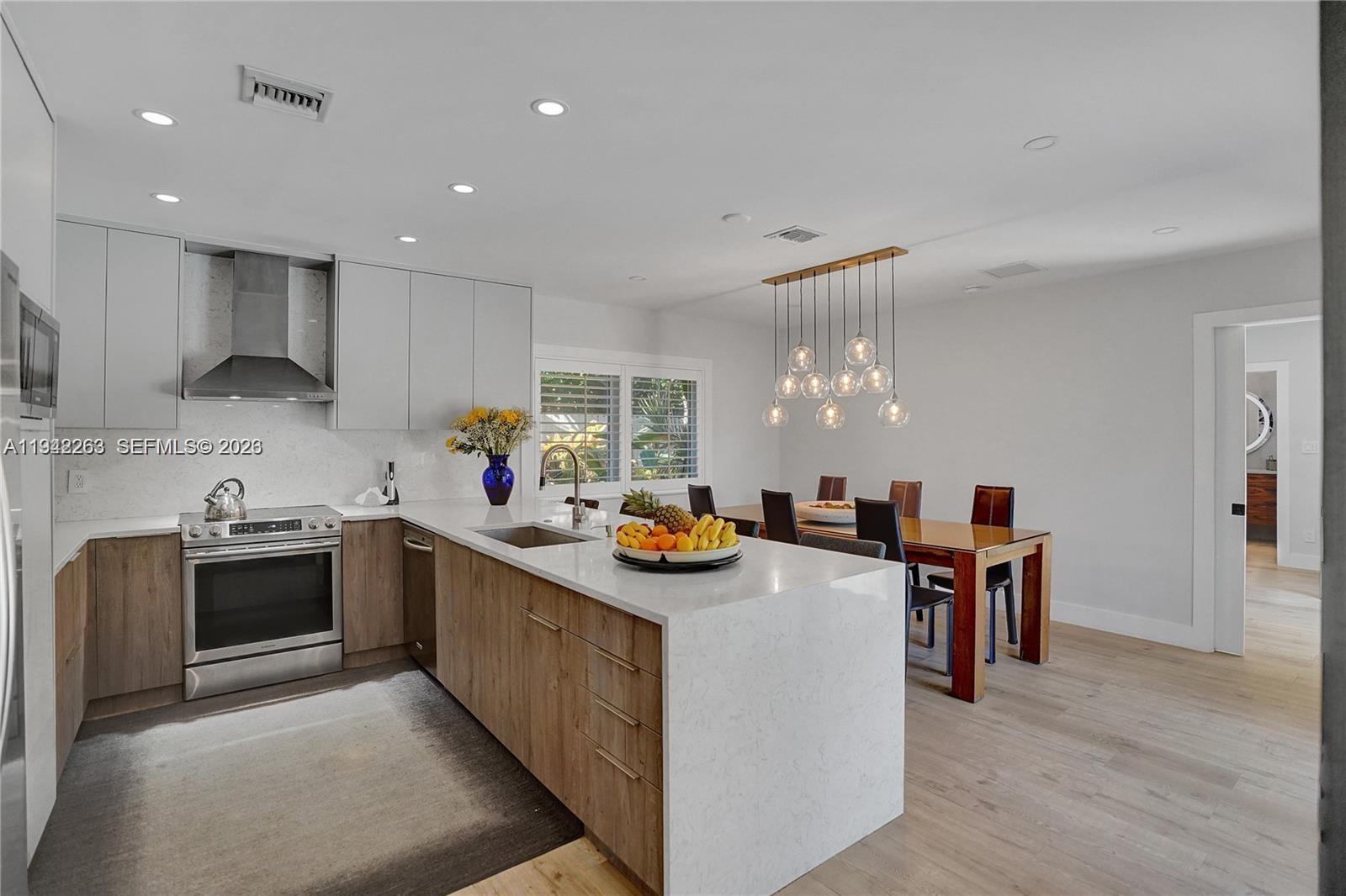 2011 Northeast 31st Court Lighthouse Point, FL 33064 - Photo 7 of 33 a kitchen with granite countertop lots of counter top space