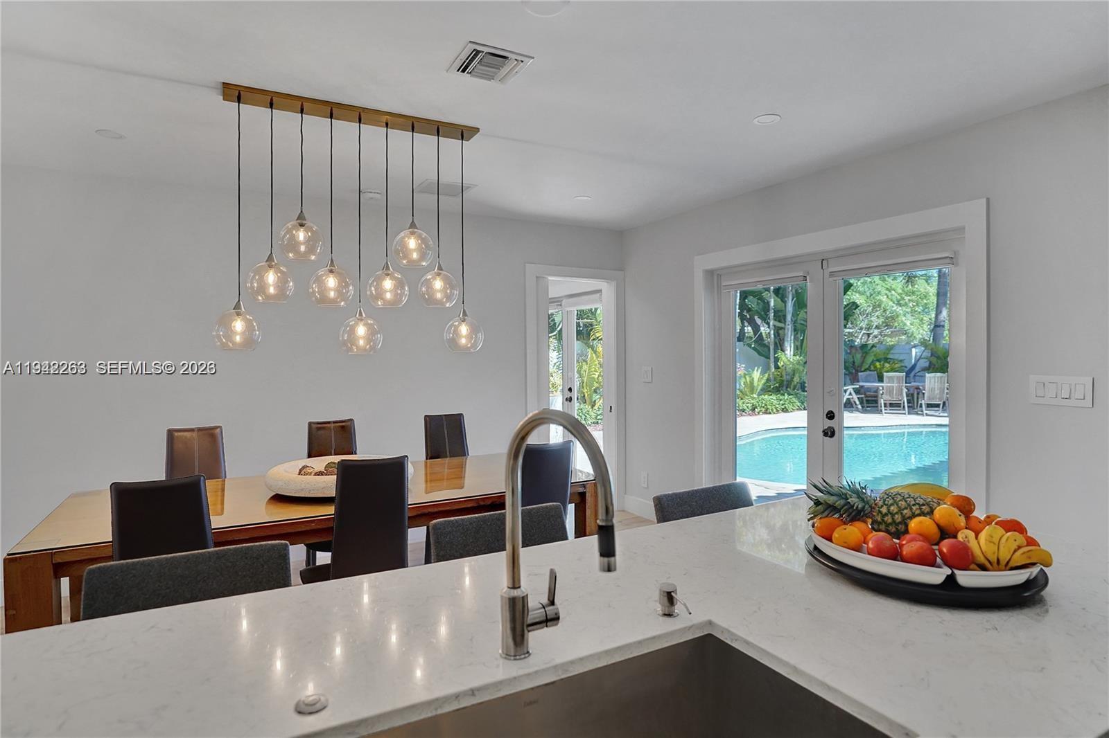 2011 Northeast 31st Court Lighthouse Point, FL 33064 - Photo 8 of 33 a view of a livingroom with furniture and window