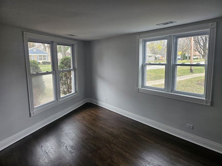 808 Indian Road Glenview, IL 60025 - Photo 12 of 20 a view of an empty room with wooden floor and a window