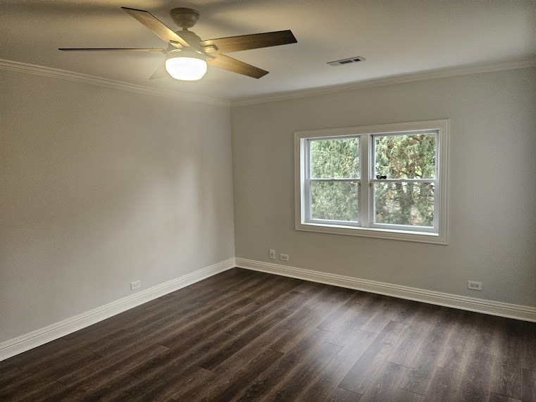 808 Indian Road Glenview, IL 60025 - Photo 15 of 20 a view of an empty room with wooden floor and a window