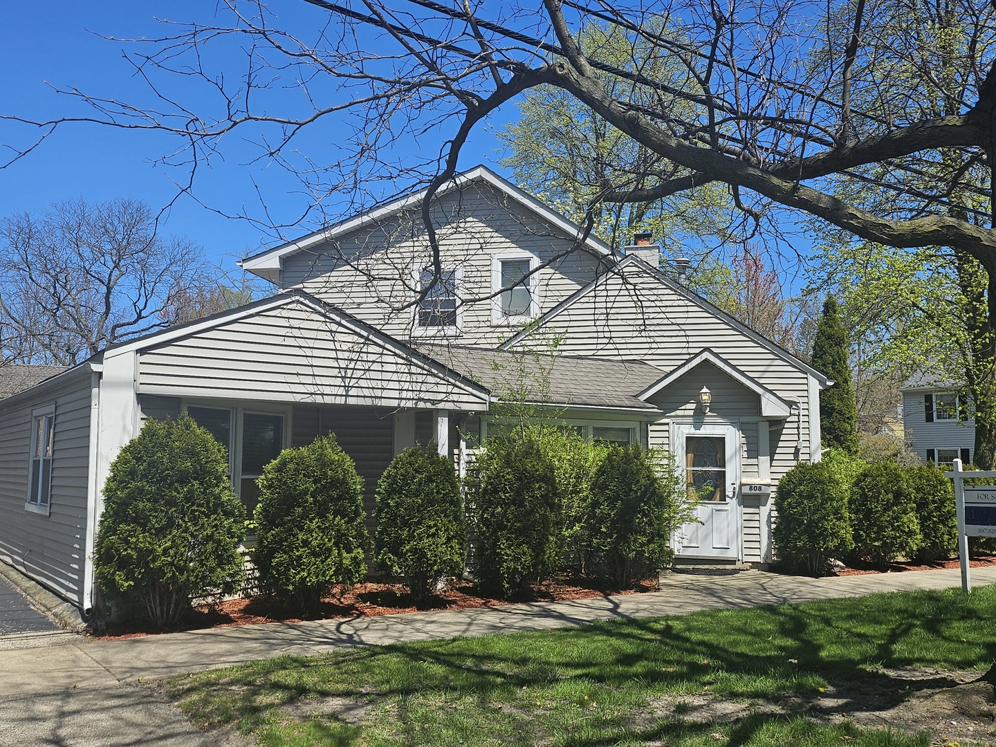 808 Indian Road Glenview, IL 60025 - Photo 17 of 20 a front view of a house with a yard