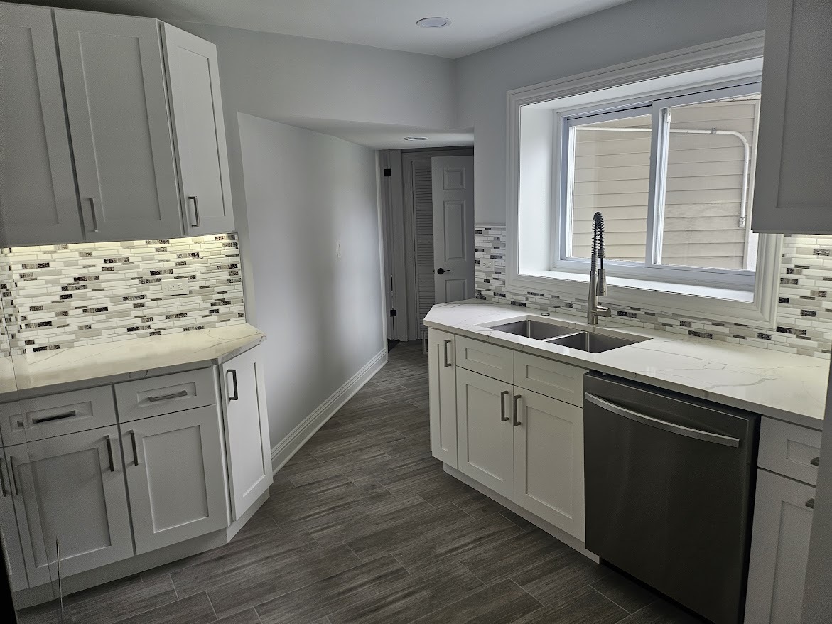808 Indian Road Glenview, IL 60025 - Photo 3 of 20 a kitchen with granite countertop a sink and dishwasher with wooden floor