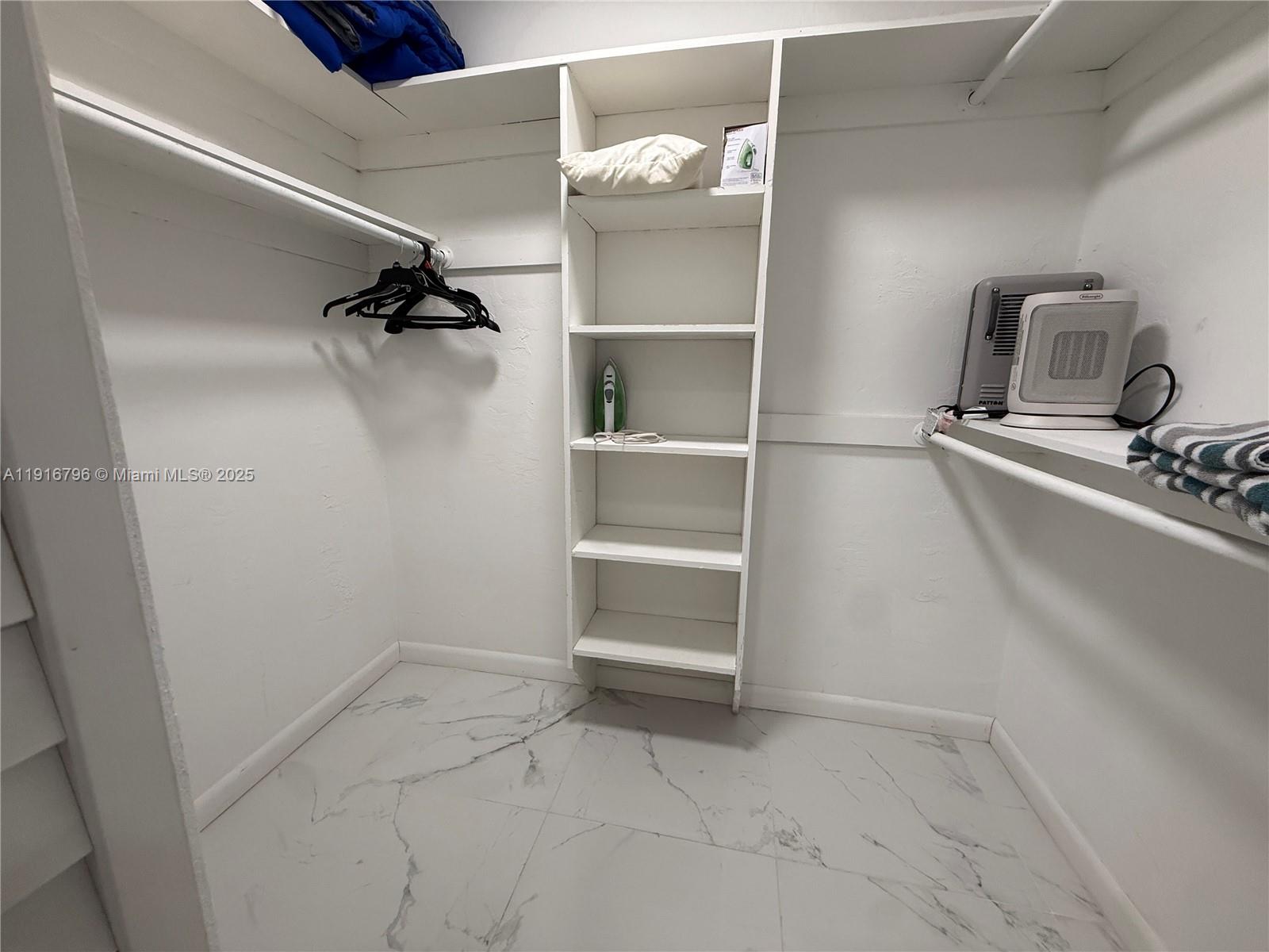 8636 Beekman Drive, Unit 8636 Miramar, FL 33025 - Photo 10 of 18 a view of an empty walk in closet