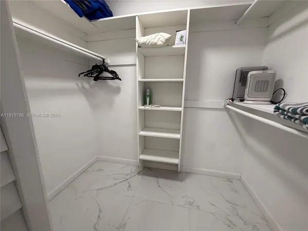 a view of an empty walk in closet