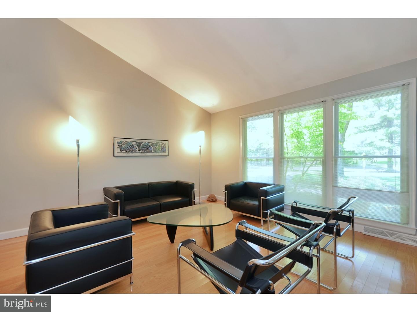 32 Penn Lyle Road Princeton Junction, NJ 08550 - Photo 2 of 25 a living room with furniture a wooden floor and a large window