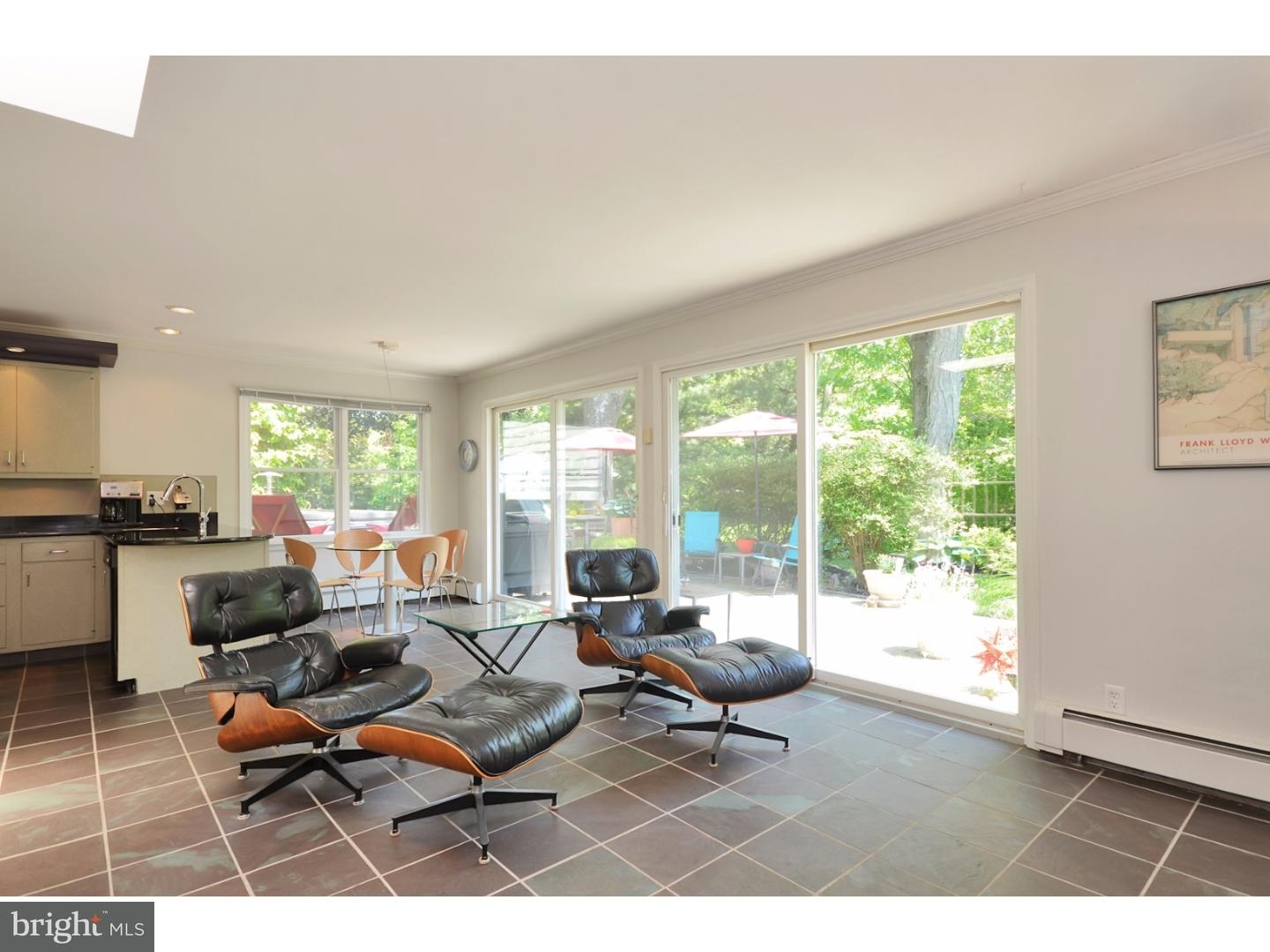32 Penn Lyle Road Princeton Junction, NJ 08550 - Photo 12 of 25 a living room with furniture and a floor to ceiling window
