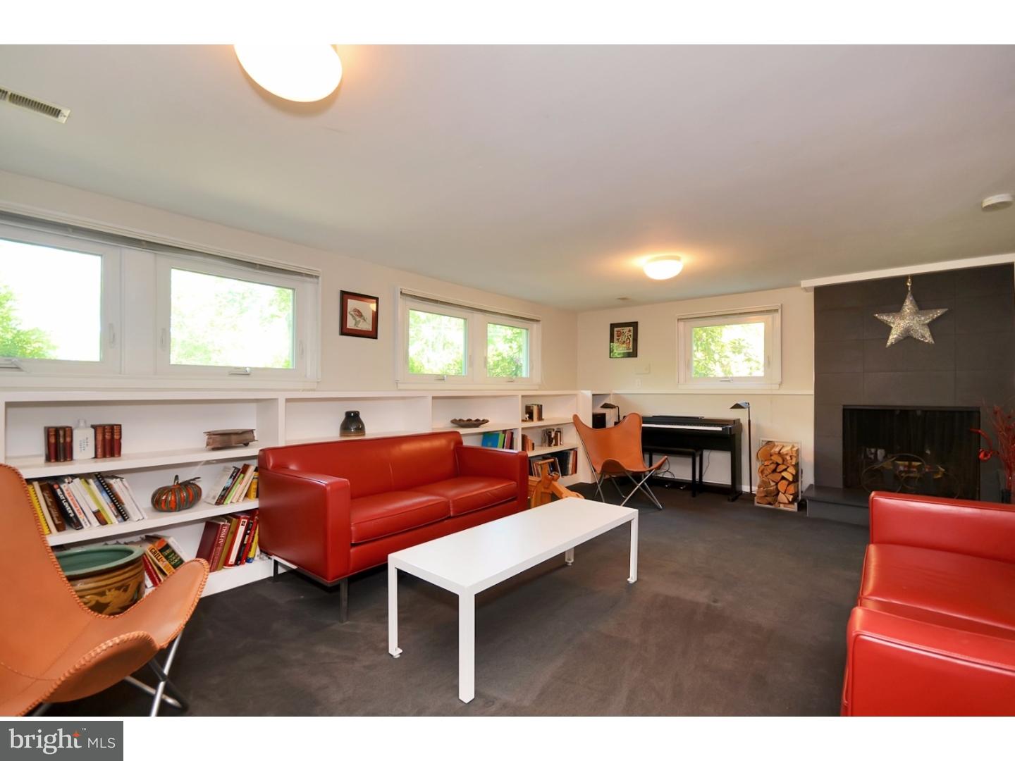 32 Penn Lyle Road Princeton Junction, NJ 08550 - Photo 16 of 25 a living room with furniture a fireplace and a window