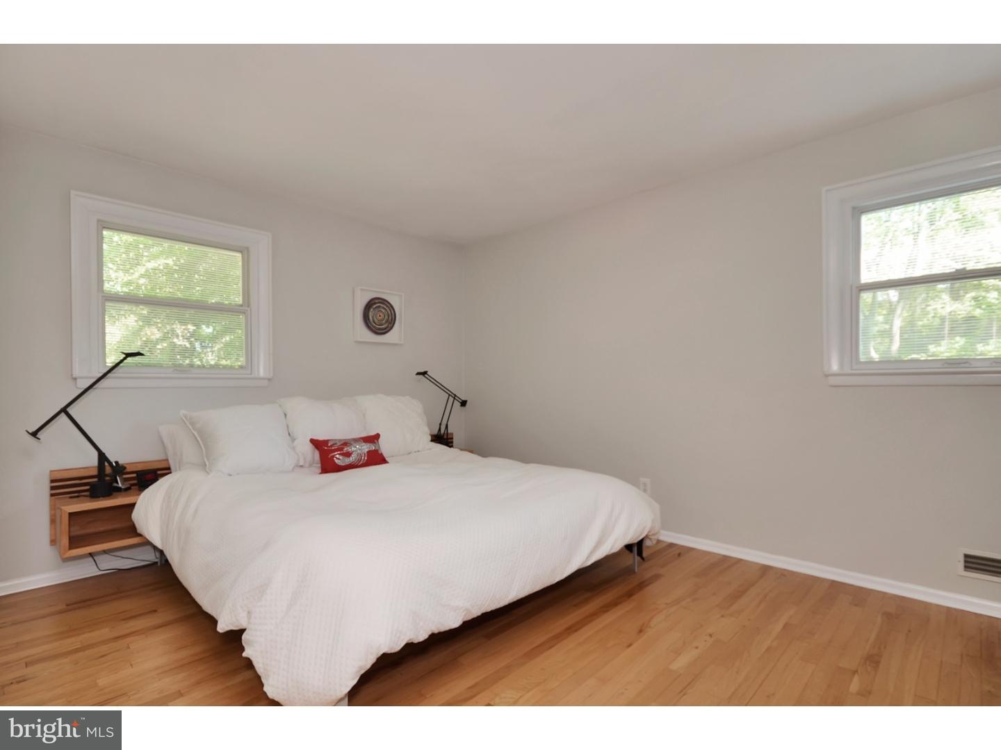 32 Penn Lyle Road Princeton Junction, NJ 08550 - Photo 18 of 25 a bedroom with a bed and a window