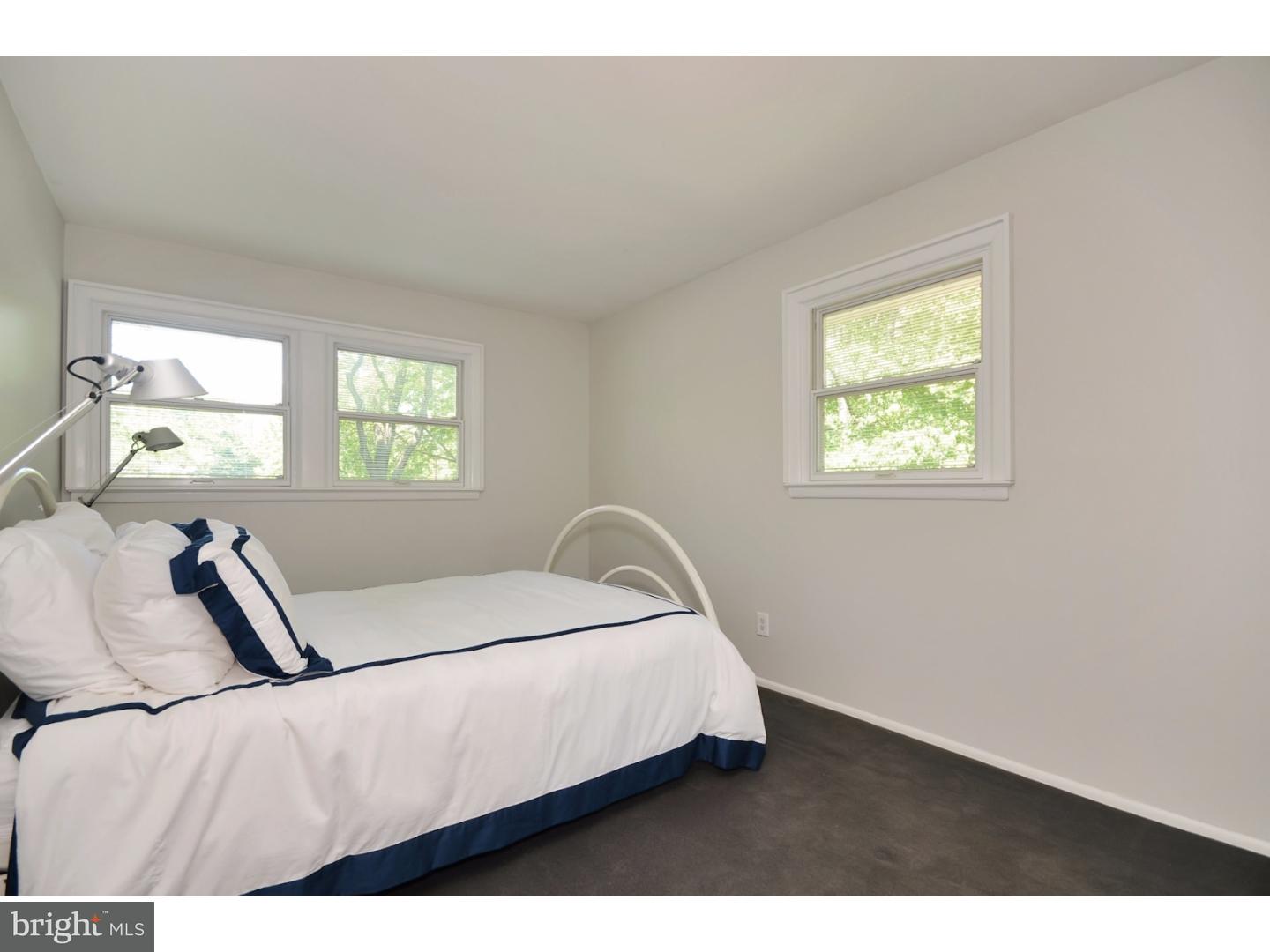 32 Penn Lyle Road Princeton Junction, NJ 08550 - Photo 20 of 25 a bed sitting in a bedroom next to a window