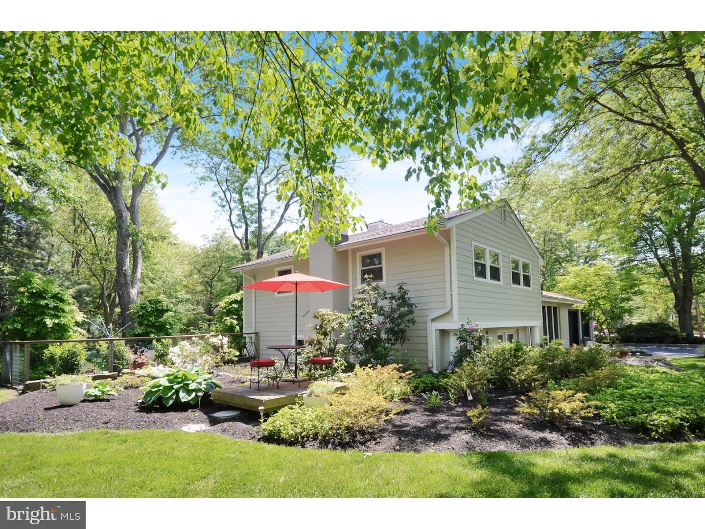 32 Penn Lyle Road Princeton Junction, NJ 08550 - Photo 23 of 25 a front view of a house with a yard and potted plants