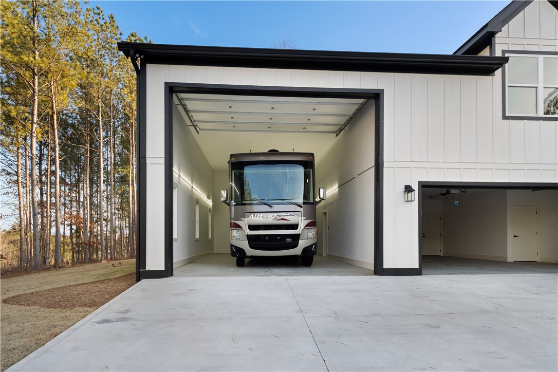 147 McAlister Road West Union, SC 29696 - Photo 39 of 49 This spacious garage offers ample room for vehicles with convenient access. 50 AMP plug and clean out drain.
