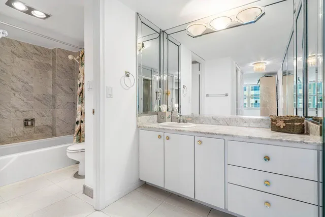 a bathroom with a toilet and a bathtub