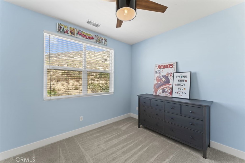 19120 Blackthorn Drive Canyon Country, CA 91351 - Photo 26 of 40 Upstairs bedroom with custom paint and ceiling fan