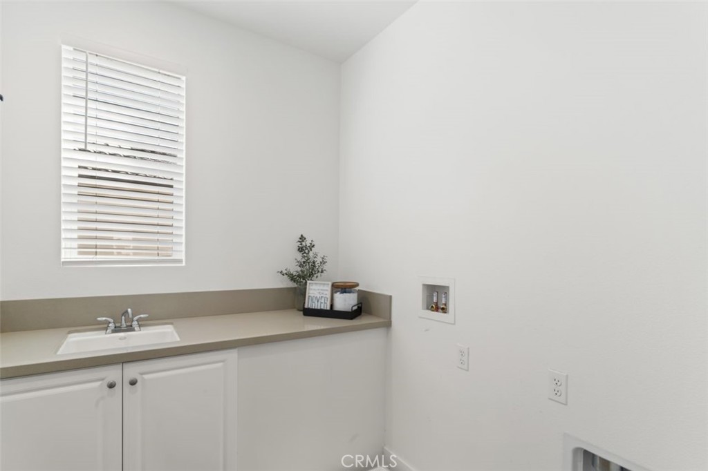 19120 Blackthorn Drive Canyon Country, CA 91351 - Photo 27 of 40 Upstairs laundry room with sink and countertop