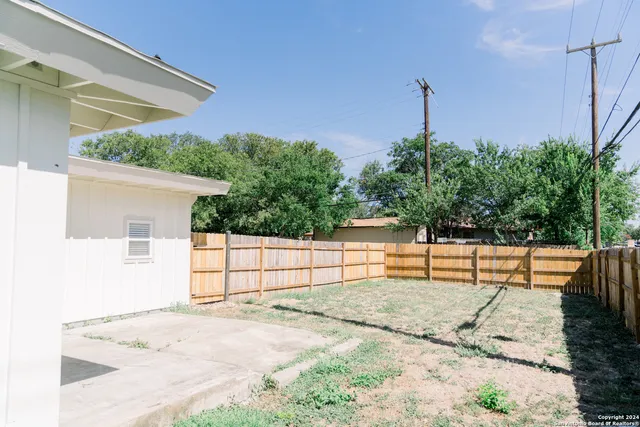 a view of a porch with wooden floor