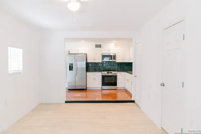 a view of kitchen with wooden floor