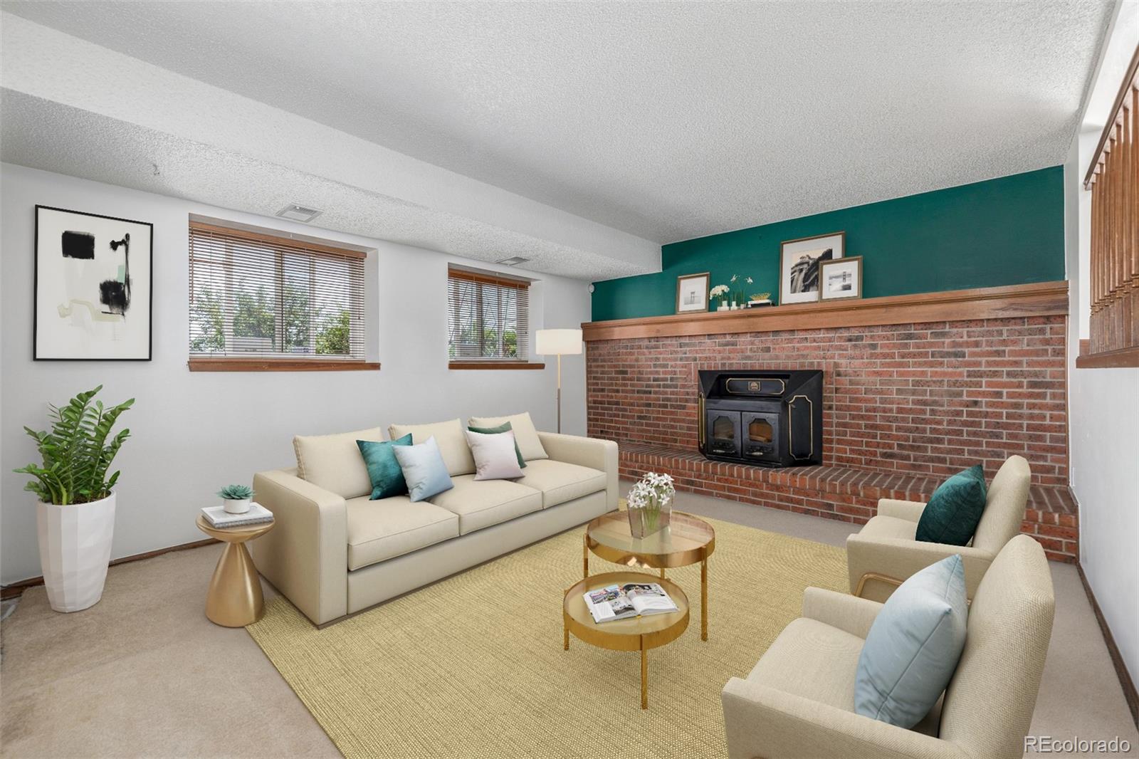 18083 East Atlantic Drive Aurora, CO 80013 - Photo 12 of 22 a living room with furniture and a fireplace