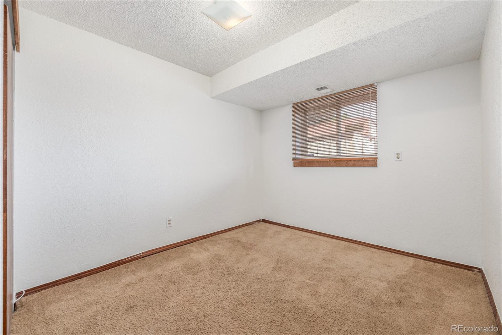 18083 East Atlantic Drive Aurora, CO 80013 - Photo 13 of 22 an empty room with a window