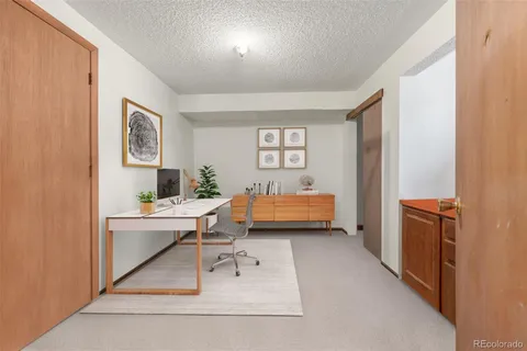 a bedroom with furniture and a window