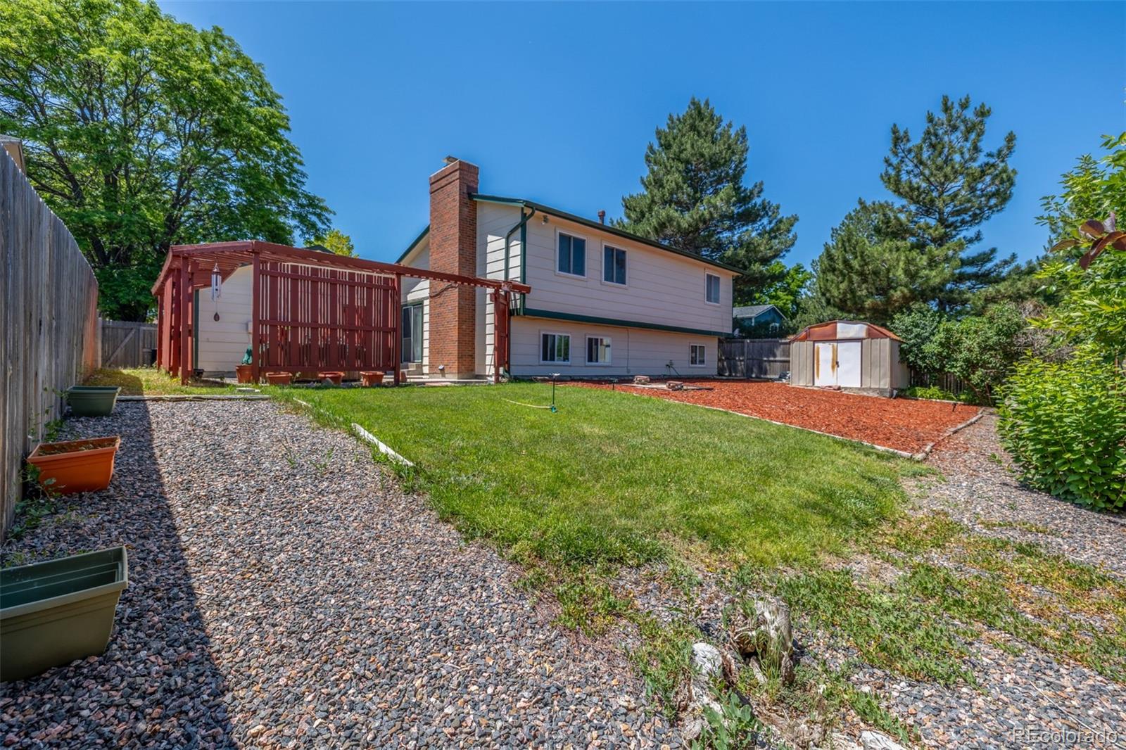 18083 East Atlantic Drive Aurora, CO 80013 - Photo 21 of 22 a view of a house with backyard and sitting area