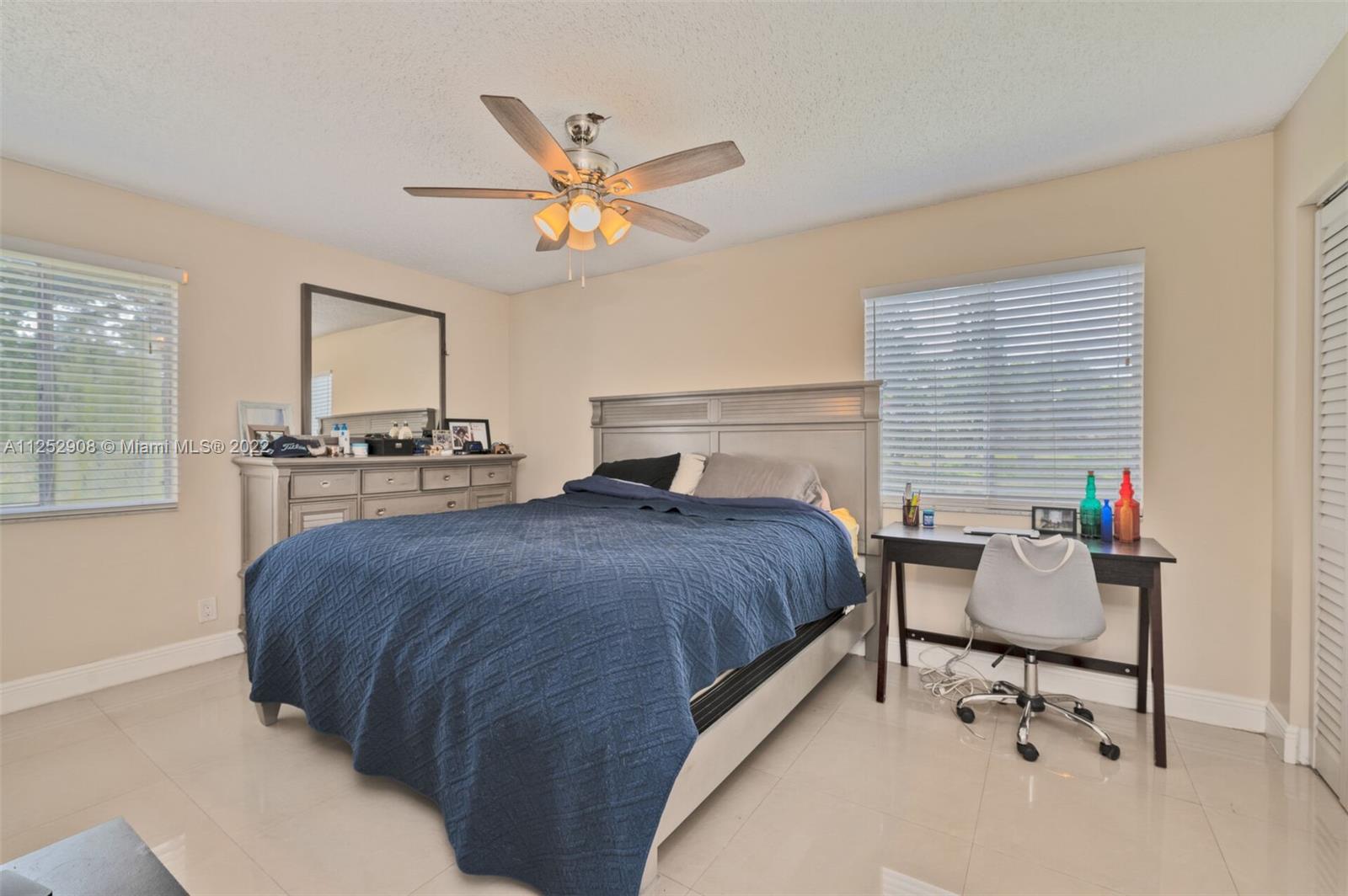 18790 Cloud Lake Circle Boca Raton, FL 33496 - Photo 11 of 27 a bedroom with a bed and window