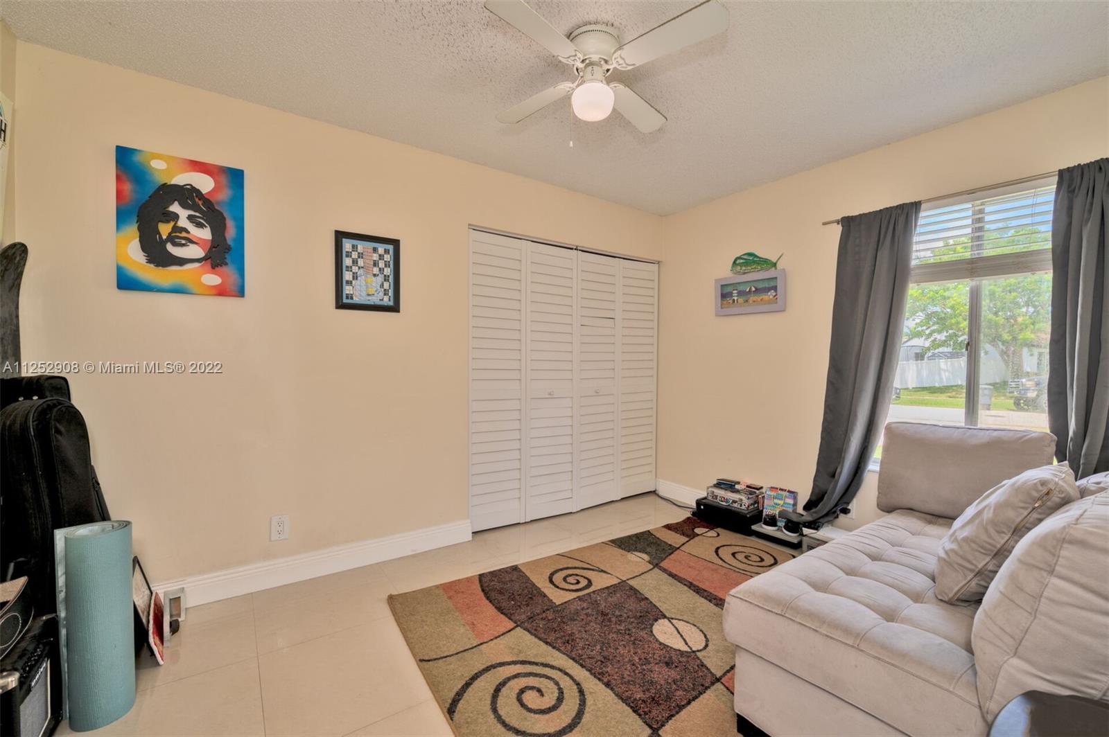 18790 Cloud Lake Circle Boca Raton, FL 33496 - Photo 14 of 27 a living room with furniture and a window