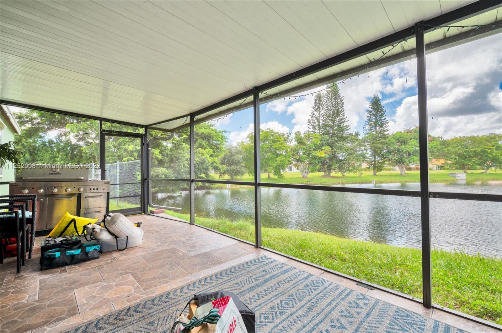 18790 Cloud Lake Circle Boca Raton, FL 33496 - Photo 16 of 27 a view of swimming pool with seating area