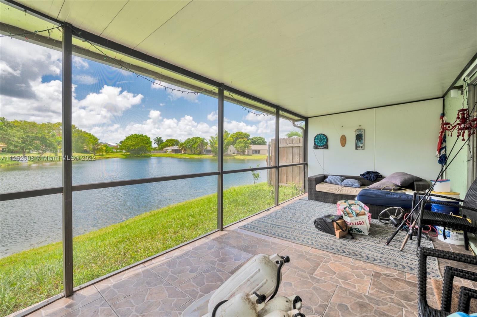 18790 Cloud Lake Circle Boca Raton, FL 33496 - Photo 17 of 27 a view of a floor to ceiling window in an outdoor space