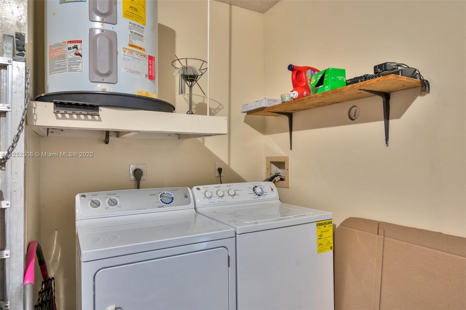 18790 Cloud Lake Circle Boca Raton, FL 33496 - Photo 22 of 27 a utility room with dryer and washer