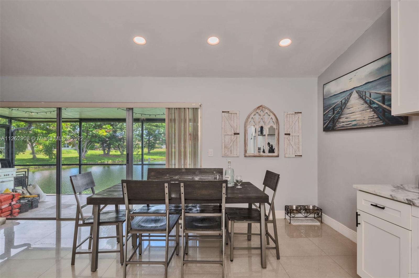 18790 Cloud Lake Circle Boca Raton, FL 33496 - Photo 6 of 27 a view of a dining room with furniture window and outside view