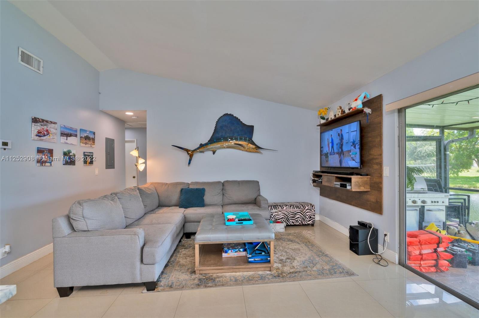 18790 Cloud Lake Circle Boca Raton, FL 33496 - Photo 7 of 27 a living room with furniture and flat screen tv