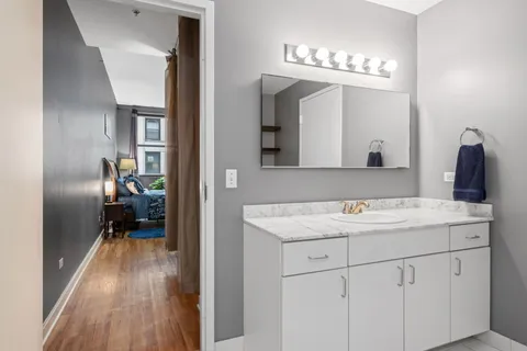 a en suite bathroom with a sink and mirror
