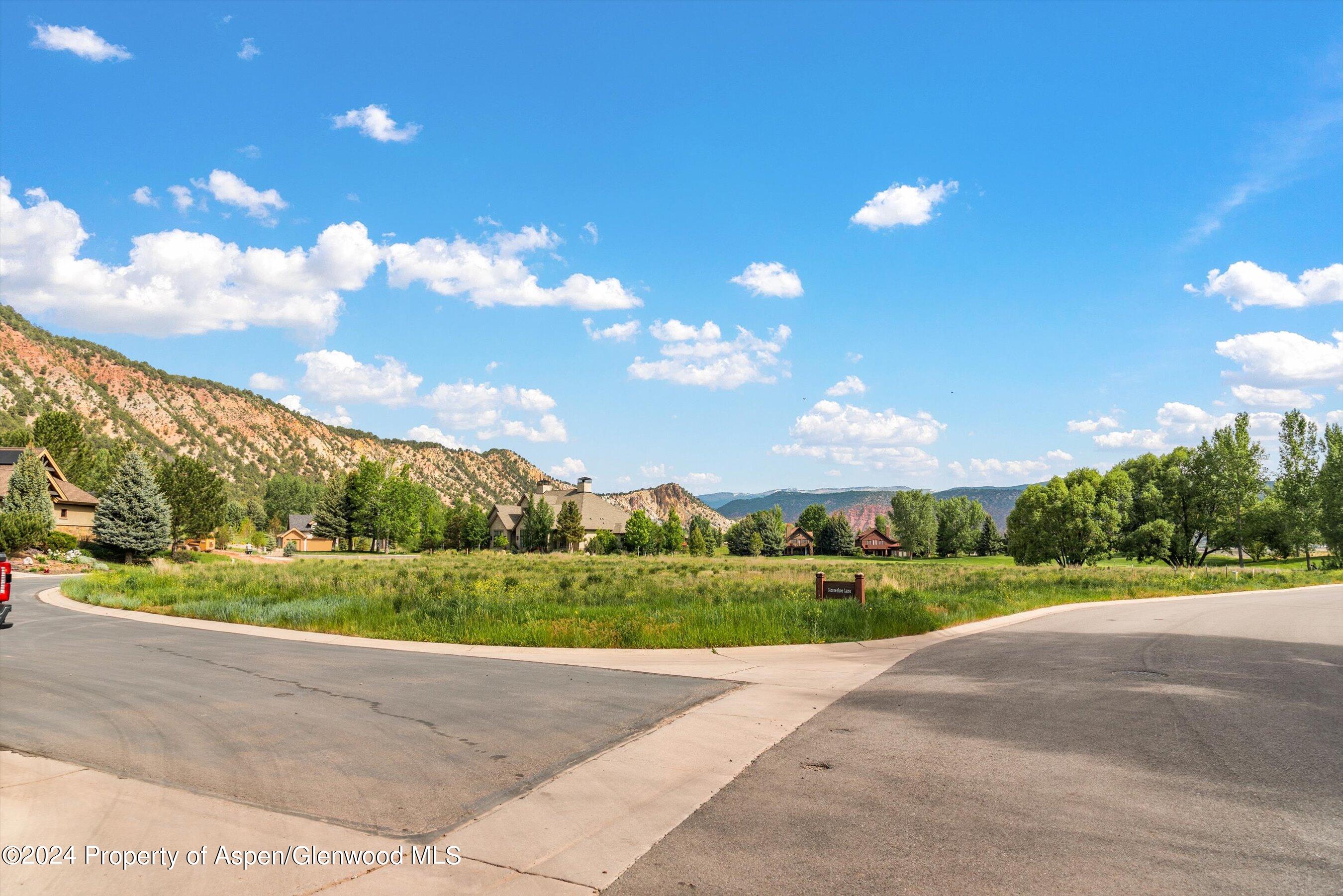 345 Saddleback Road Carbondale, CO 81623 - Photo 5 of 22 a view of a golf course with a big yard