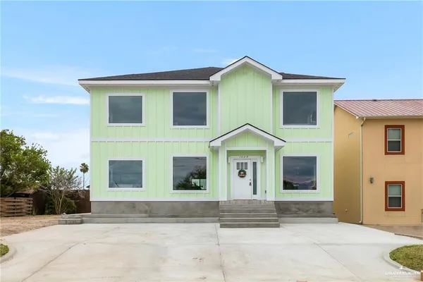 a front view of a house with garage