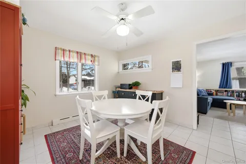 a view of a dining room with furniture and a chandelier