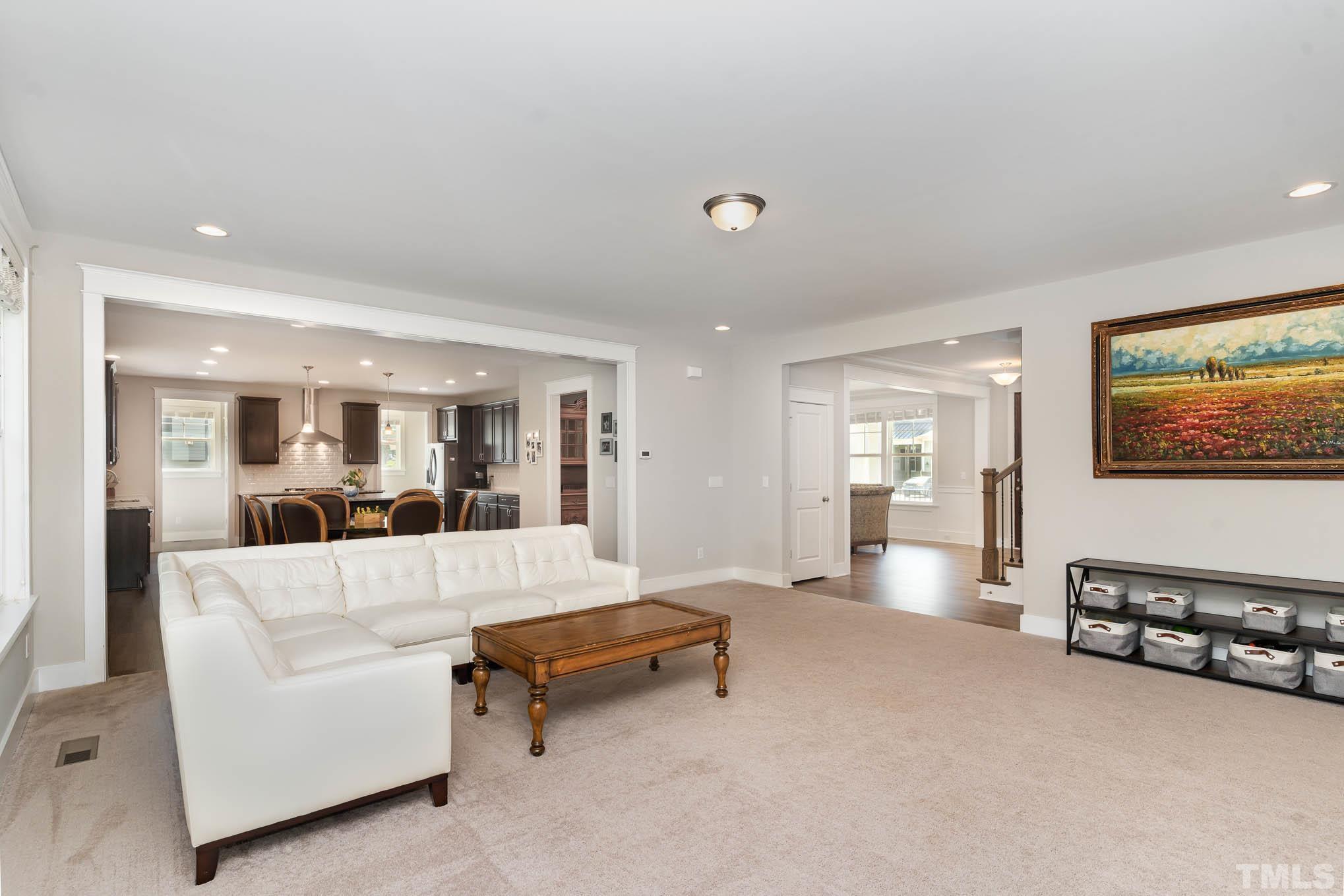 2816 Flume Gate Drive Raleigh, NC 27603 - Photo 11 of 45 a living room with furniture and a flat screen tv