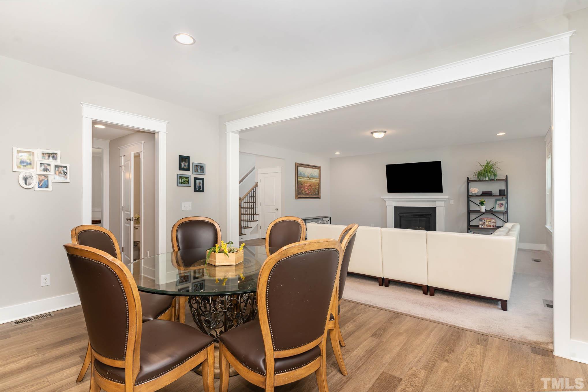 2816 Flume Gate Drive Raleigh, NC 27603 - Photo 15 of 45 a living room with furniture and a wooden floor
