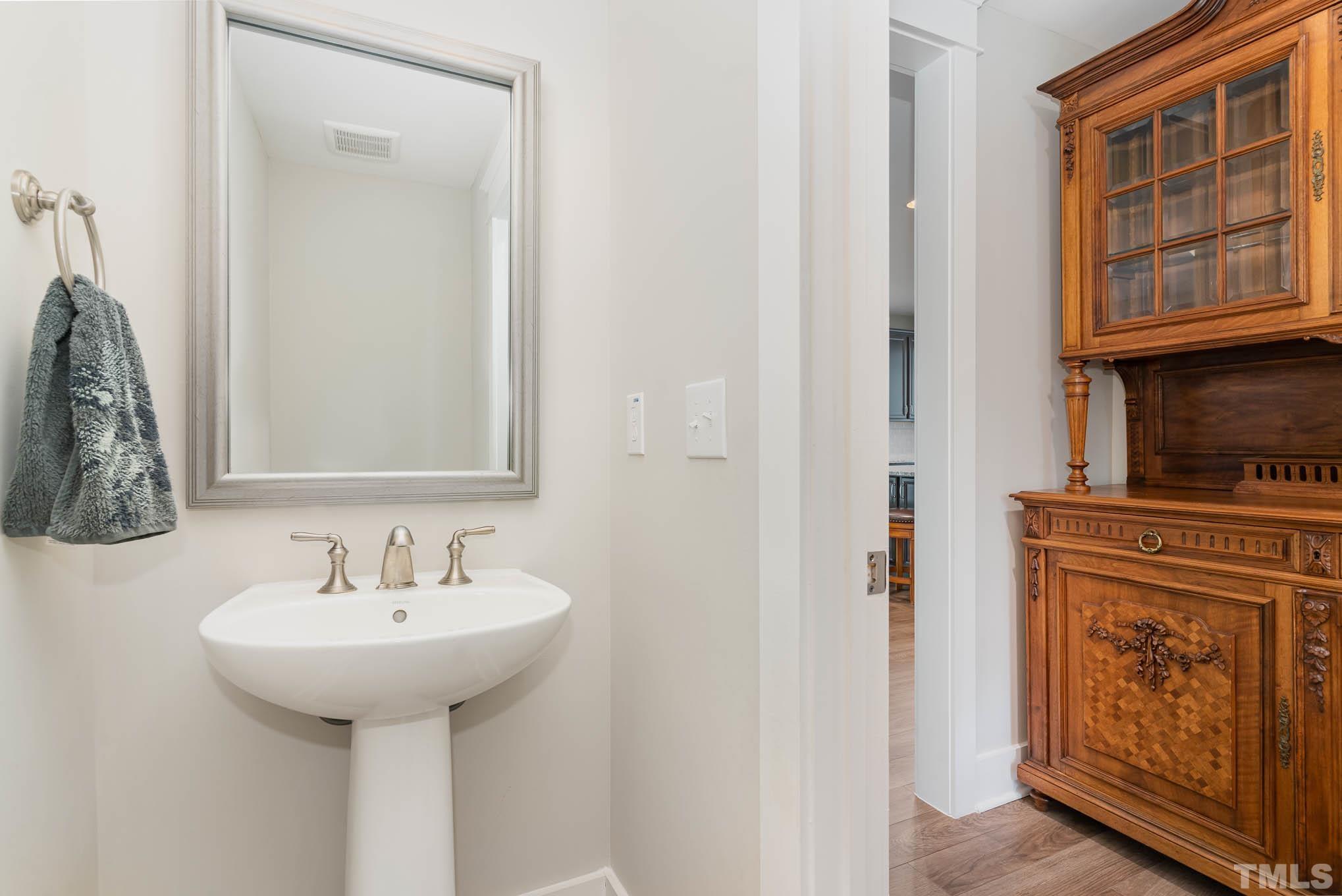 2816 Flume Gate Drive Raleigh, NC 27603 - Photo 20 of 45 a bathroom with a sink and a mirror